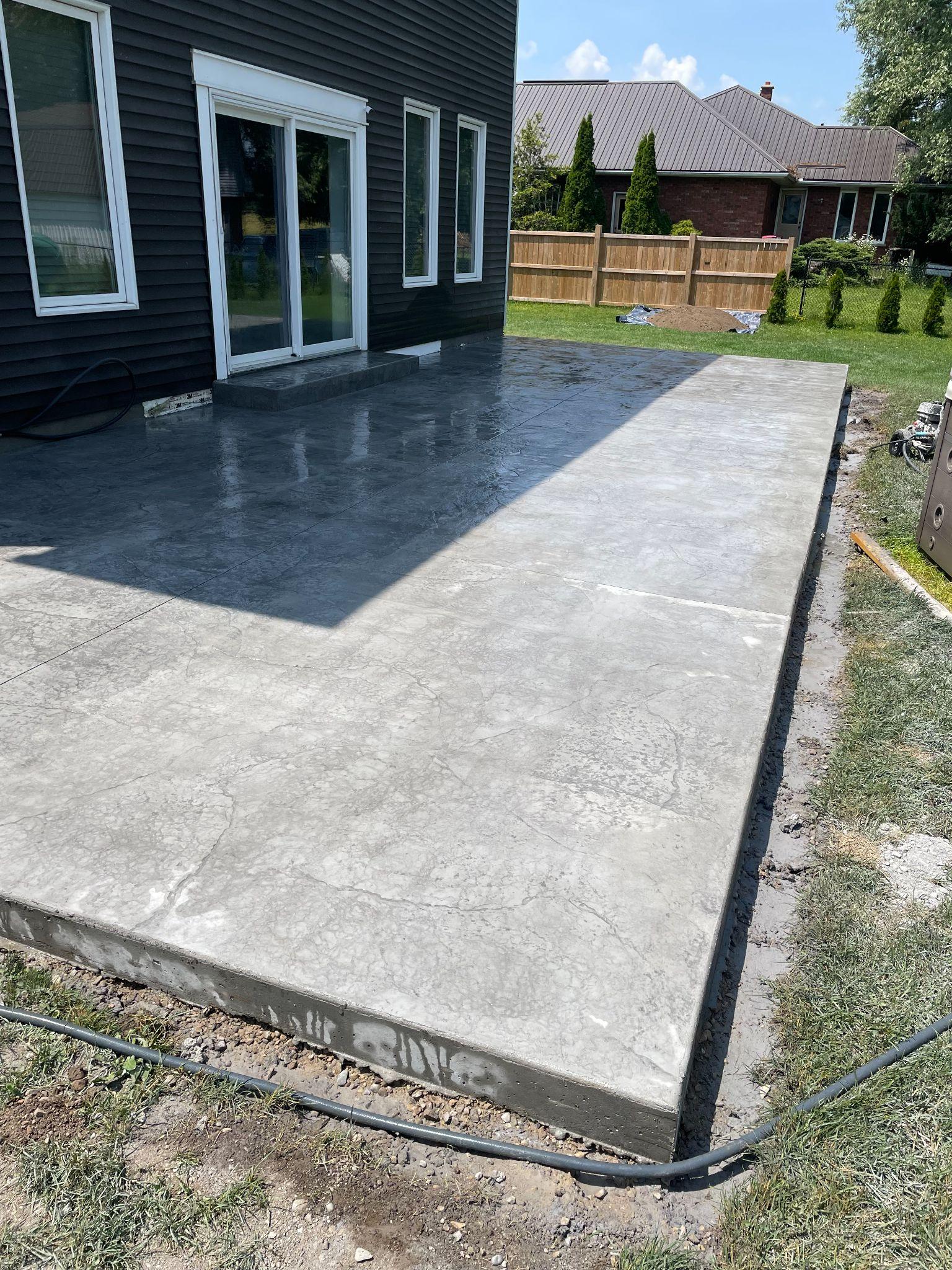 Concept rendering — Modern stamped concrete patio, two-tone finish — Kitchener-Waterloo