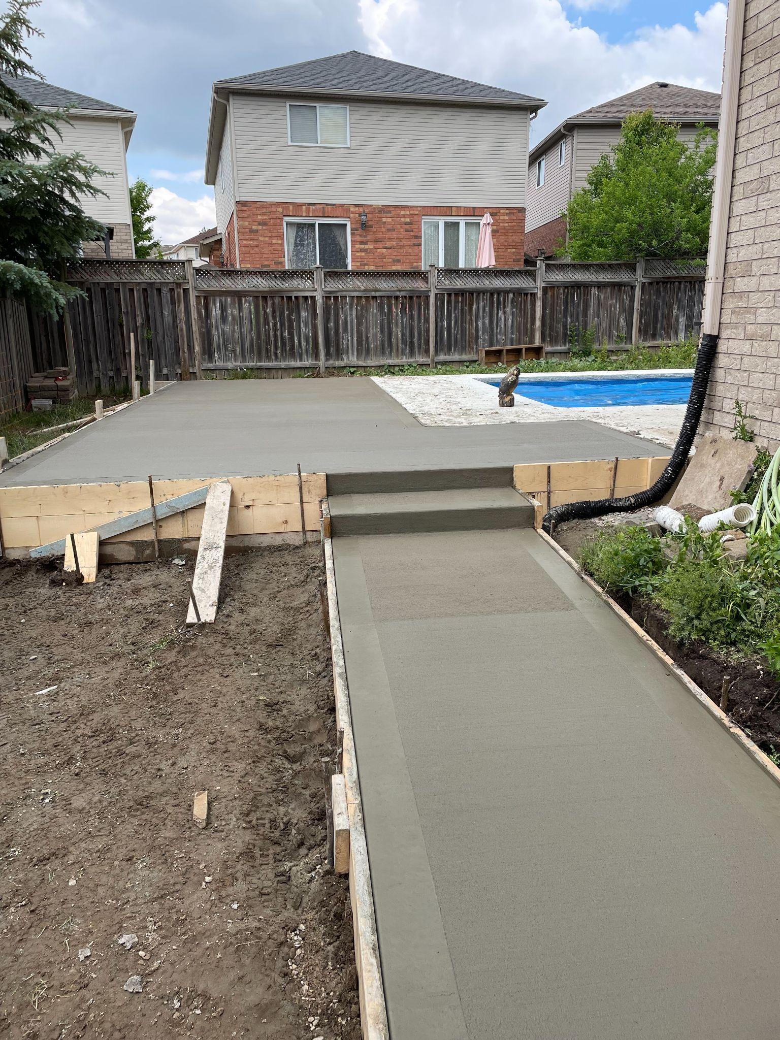 Concept rendering — Pool-side patio pour in progress